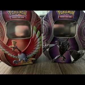 2 Pokemon card tins. Ho-oh and Necrozma.